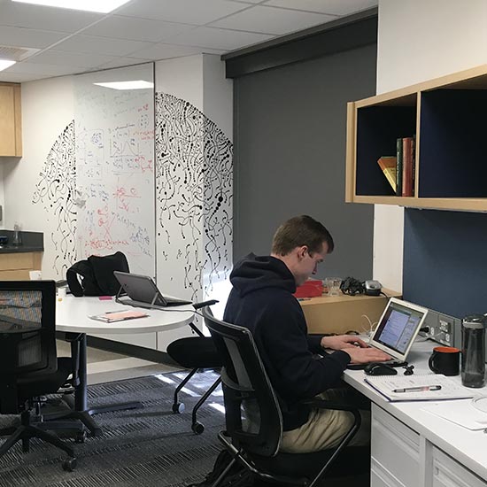 Photo of student working in SPEC lab communal space